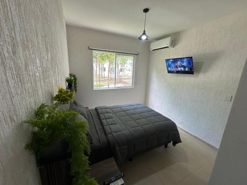 a living room with a couch and a window at Departamento Orion 3 rooms planta baja en Cancun by EITA in Cancún