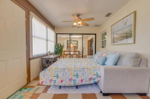 a bedroom with a bed and a couch at Private Entry-King & Queen rooms in Clearwater
