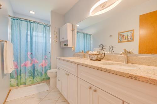 a bathroom with a sink and a toilet and a shower at Private Entry-King & Queen rooms in Clearwater