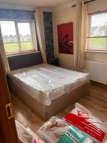 a bedroom with a bed in a room at Luxury Home in Dublin WiFi TV B&B Close to City Centre in Lucan