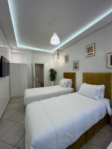 Postel nebo postele na pokoji v ubytování SUITOUISS - Océan 1 - Appartement centre ville au front de mer