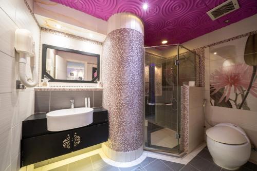 a bathroom with a sink and a shower and a toilet at Luxury Three bedroom Apt Al Yasmin in Riyadh