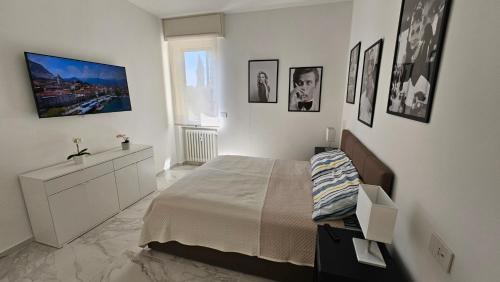 En eller flere senge i et værelse på Garda Moments Apartment