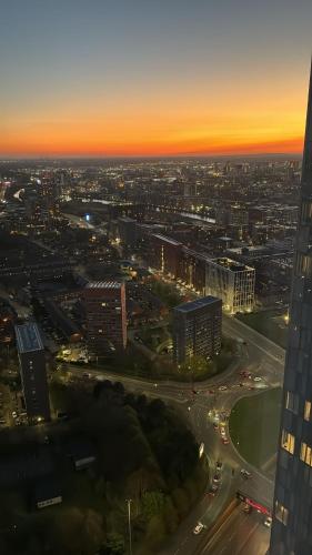 an aerial view of a city at sunset at 3 Bedroom Penthouse In The City Centre Deansgate New Build High Floor in Manchester