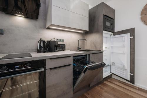 Una cocina o zona de cocina en Apartmán Viki - Rezidence K Lanovce
