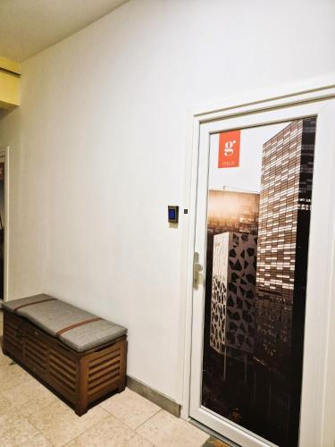 a wall with a bench in front of a building at Gajeva Rooms SELF CHECK-IN in Virovitica