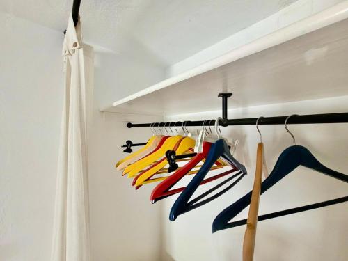 a group of colorful umbrellas hanging on a rack at Tradicional casa con impresionantes vistas in Gaucín