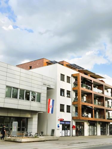 a large white building with a building at Gajeva Rooms - Stockholm apartment SELF CHECK-IN in Virovitica