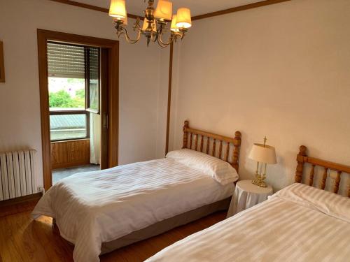 Postel nebo postele na pokoji v ubytování La Casa de la Carpintería