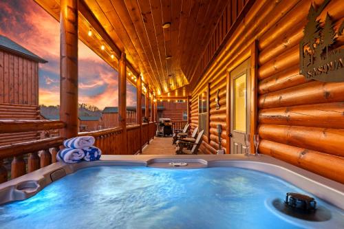 a jacuzzi tub on a log house at Sasquatch Splash Premier Private Pool Cabin with Hot Tub, Mtn Views, Arcade Games, Excellent Location in Pigeon Forge