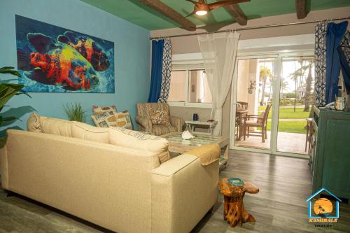 a living room with a couch and a table at STANZA MARE 1 Br,2Br,3Br APARTAMENT ON THE BEACH in Punta Cana