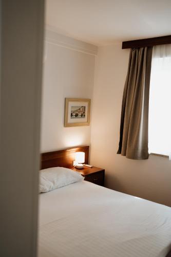 Ένα ή περισσότερα κρεβάτια σε δωμάτιο στο Apartmaji Punta