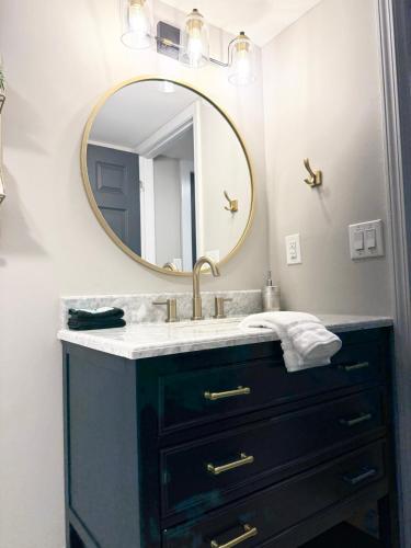 a bathroom with a sink and a mirror at Little Bit-A-Cozy, 2BR Retreat in Hickory