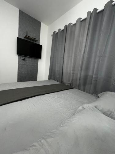 Ένα ή περισσότερα κρεβάτια σε δωμάτιο στο Flat Moderno III - Próximo ao Centro