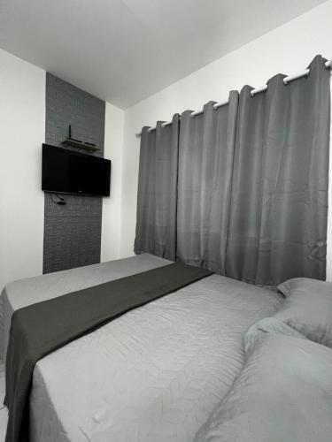 Ένα ή περισσότερα κρεβάτια σε δωμάτιο στο Flat Moderno III - Próximo ao Centro