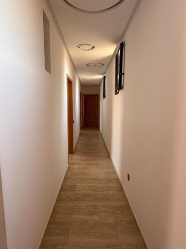 a corridor of a hallway with white walls and a ceiling at Villa Denalya in Marrakech