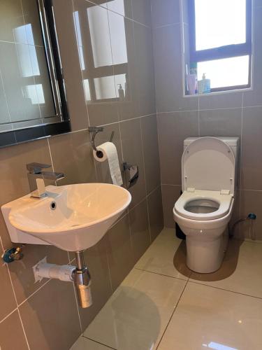 a bathroom with a sink and a toilet at The Serene Gift in Mbabane