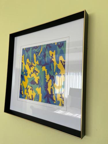 a picture hanging on a wall in a frame at The Serene Gift in Mbabane