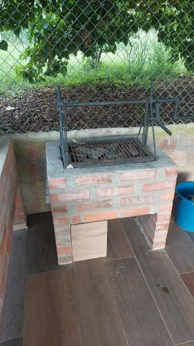 a stone bench sitting on top of a brick wall at Villa RIVAR in Santa Helena