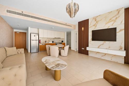 a living room with a couch and a table at La Vie, JBR, Dubai in Dubai