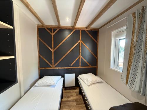 Postel nebo postele na pokoji v ubytování Camping Le Sorlut