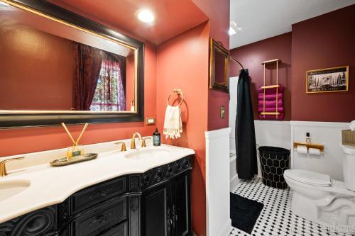 a bathroom with a sink and a toilet at The Victorian Fox in Saint Charles
