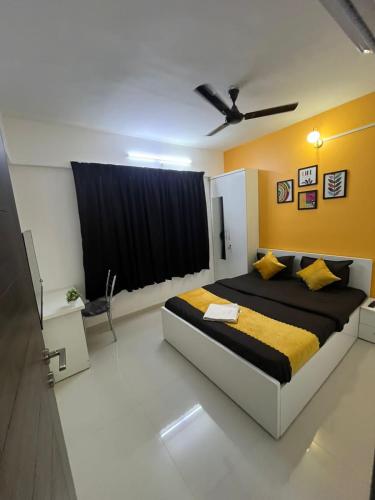 a bedroom with a large bed in a room at Luxurious 3bhk Apartments in Pune