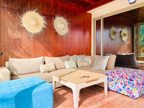 a living room with a couch and a coffee table at Villa Sunset Moulay Bouzerktoun in Essaouira