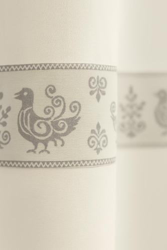 aplate with a drawing of a bird on a wall at Villa Panoramica Vista Mare in Capitana