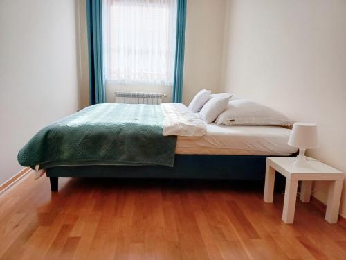 Postel nebo postele na pokoji v ubytování Apartamenty Aneta
