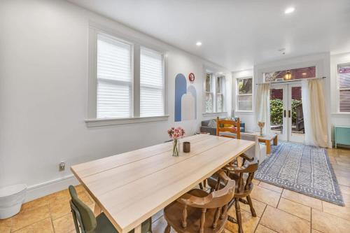 a dining room with a wooden table and chairs at #Urban Elegance 3BR With Parking Near UC BART & Downtown in Berkeley