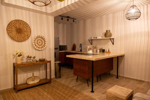 a kitchen with a table and a counter top at Ocean Park Beach Club - Property Takeover in San Juan