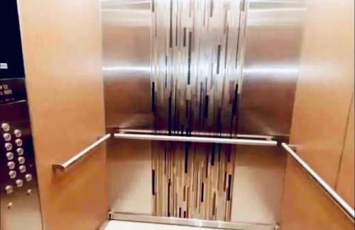 a stainless steel refrigerator with some water in it at Bayfront Luxury beachfront escape with Pool in Portmore Book Now in Portmore
