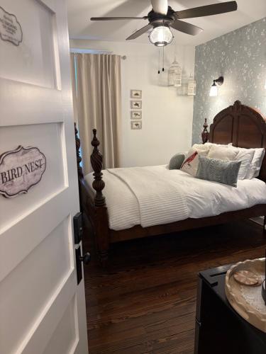 a bedroom with a bed and a ceiling fan at The Grand Castalian Inn Bed and Breakfast in Berkeley Springs