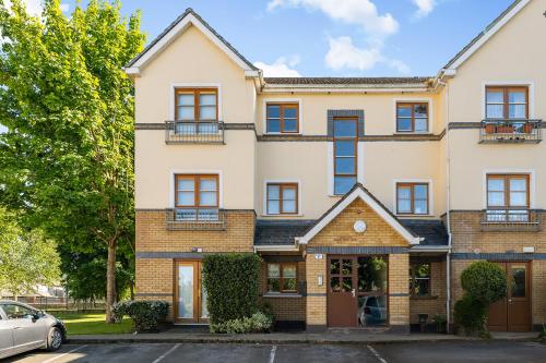 an apartment building with a car parked in front of it at South Dublin Oasis in Dublin