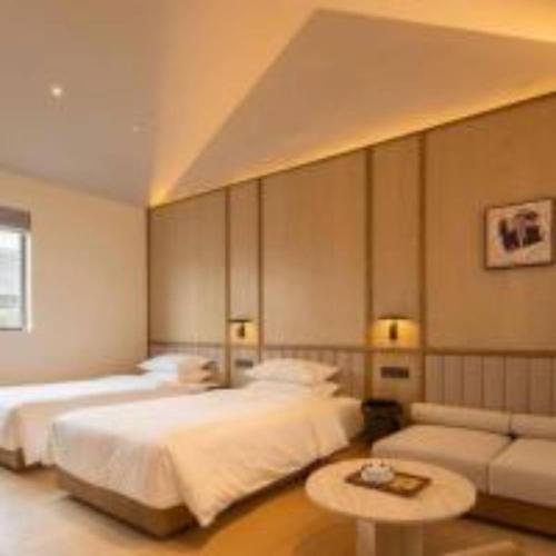 Cama o camas de una habitación en 扬州广陵有熊酒店