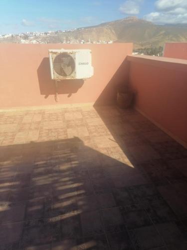 a view of a room with aburning sqor sqorktopktop at Dar Aourir in Aourir