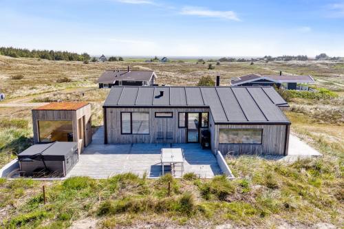 an overhead view of a house in a field at Feriehus 1043 in Hvide Sande