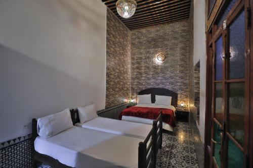 Cama o camas de una habitación en Riad Fes Zyna