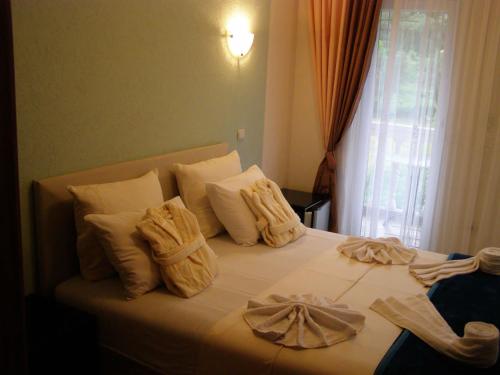 Katil atau katil-katil dalam bilik di Hotel Wellness & Spa Angelo Gabriel