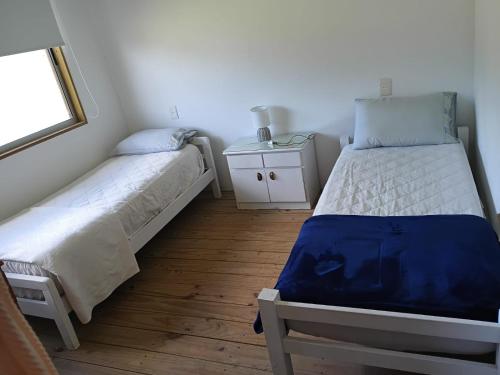 Ένα ή περισσότερα κρεβάτια σε δωμάτιο στο Runa, Marcos de los Reyes villa serrana