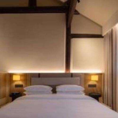 Cama o camas de una habitación en 扬州广陵有熊酒店