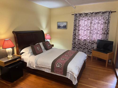 Postel nebo postele na pokoji v ubytování Rodmay Hotel