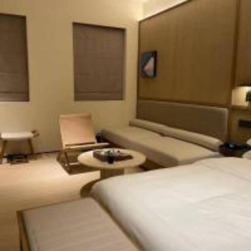 Cama o camas de una habitación en 扬州广陵有熊酒店