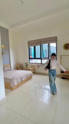 Ένα ή περισσότερα κρεβάτια σε δωμάτιο στο Haly Homestay