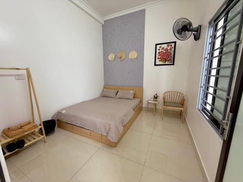 Ένα ή περισσότερα κρεβάτια σε δωμάτιο στο Haly Homestay