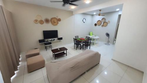 a living room with a couch and a table at 74 pangkorocean villa88 in Kampong Sungai Udang
