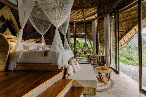 Ένα ή περισσότερα κρεβάτια σε δωμάτιο στο Vishala Retreat Bali