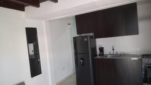 Kuchyň nebo kuchyňský kout v ubytování Apartaestudio Acogedor