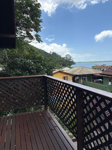 a wooden deck with a view of the ocean at Solar da Lagoa in Florianópolis
